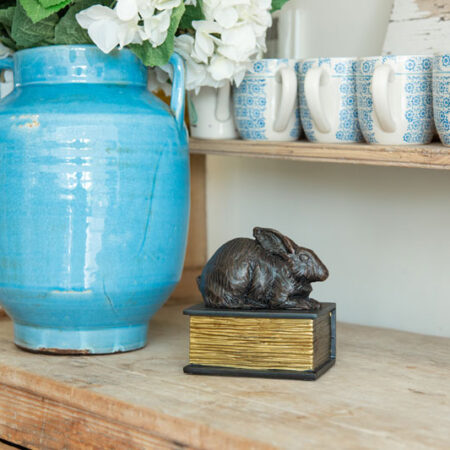 Rabbit on a book urn